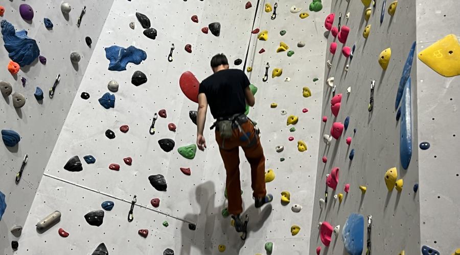 Outdoorlads climbers on the rainbow feature wall