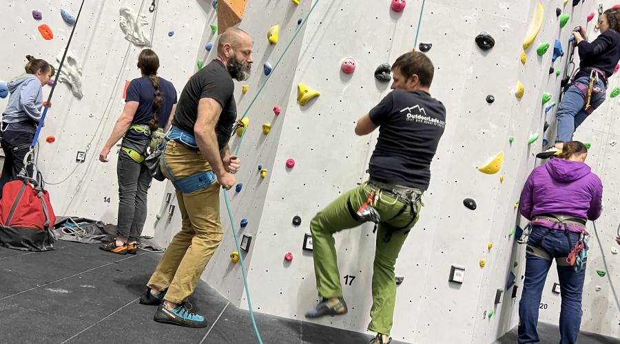 Outdoorlads climbers on the rainbow feature wall