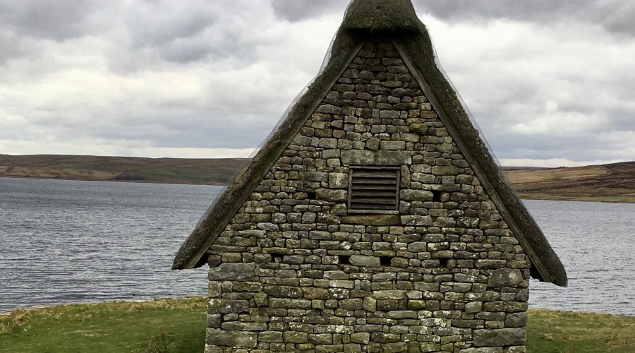 Reservoir view with cloudy sky above