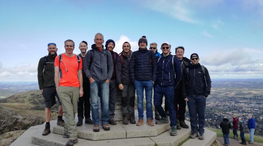 Group of walkers at the summit of Worcestershire Beacon, Malvern Hills 