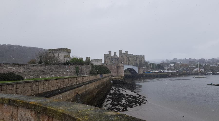 Conwy castle with the rainbow behind