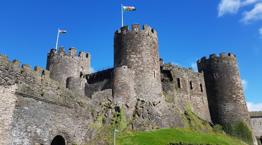 Conwy castle with the rainbow behind