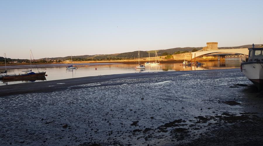 Conwy castle with the rainbow behind