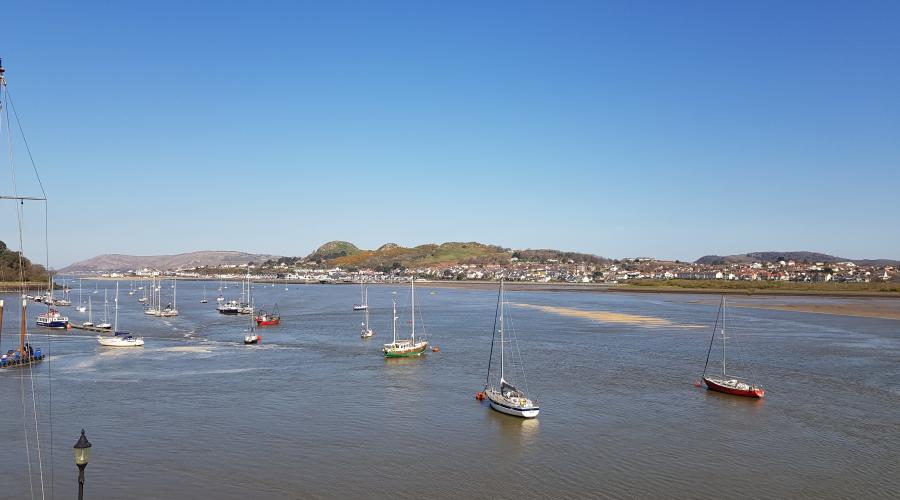 Conwy castle with the rainbow behind