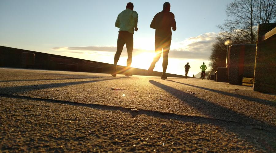 Image of a man running though a park