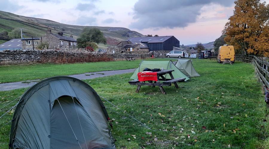 Autumn colours at wide waterfall , blue sky above