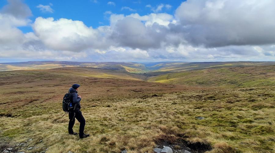 Autumn colours at wide waterfall , blue sky above