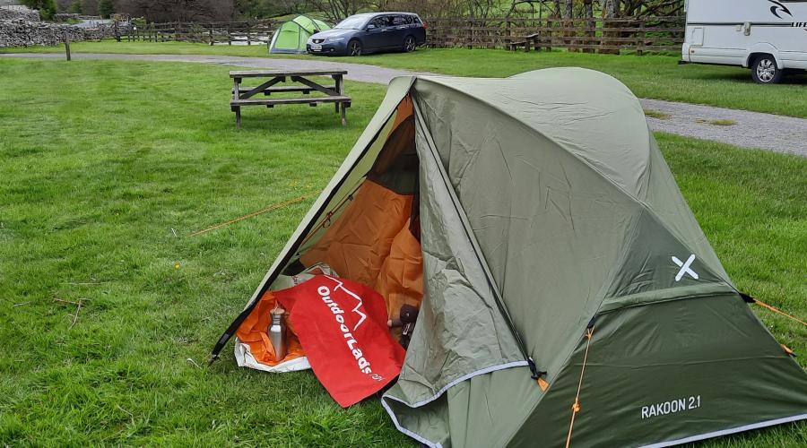 Autumn colours at wide waterfall , blue sky above