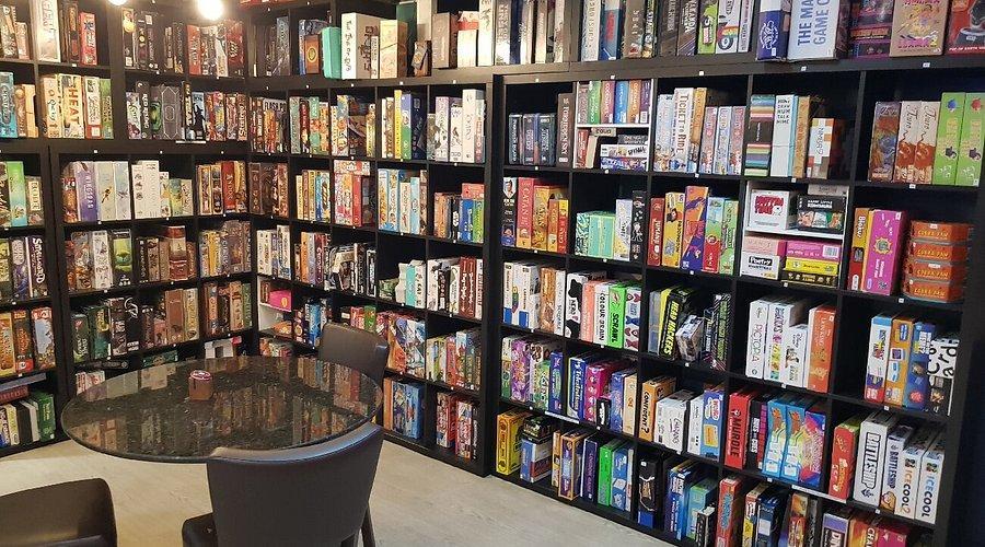 Shelves of board games - Image credit: Snacks and Ladders