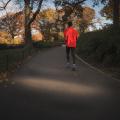 Image of a man running though a park