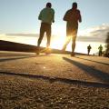Image of a man running though a park