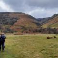 Autumn colours at wide waterfall , blue sky above