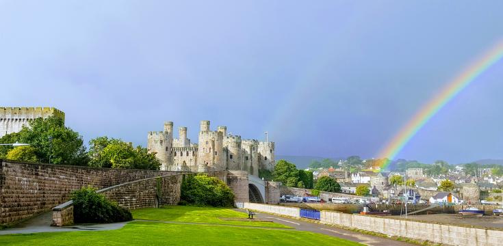 Conwy Castle with a rainbow behind